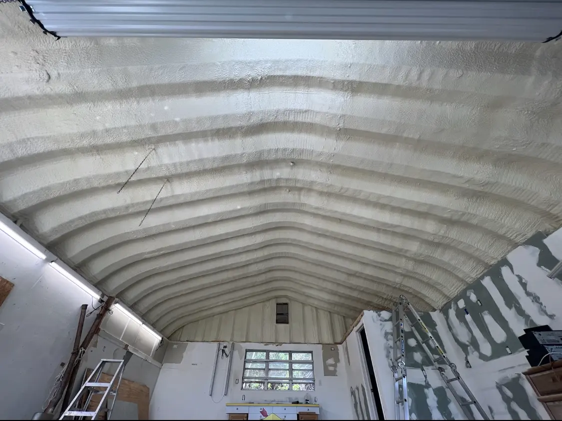 Spray polyurethane foam applied to the underside of a metal roof deck in Muscle Shoals